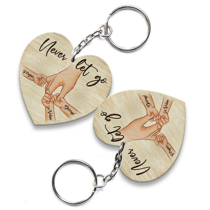 Personalized A Father Holds His Kid's Hand Never Let Go Heart Wooden Keychain