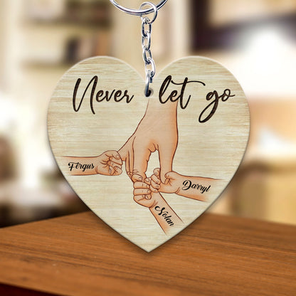 Personalized A Father Holds His Kid's Hand Never Let Go Heart Wooden Keychain