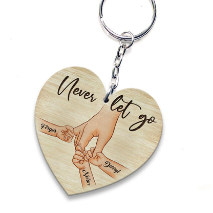 Personalized A Father Holds His Kid's Hand Never Let Go Heart Wooden Keychain