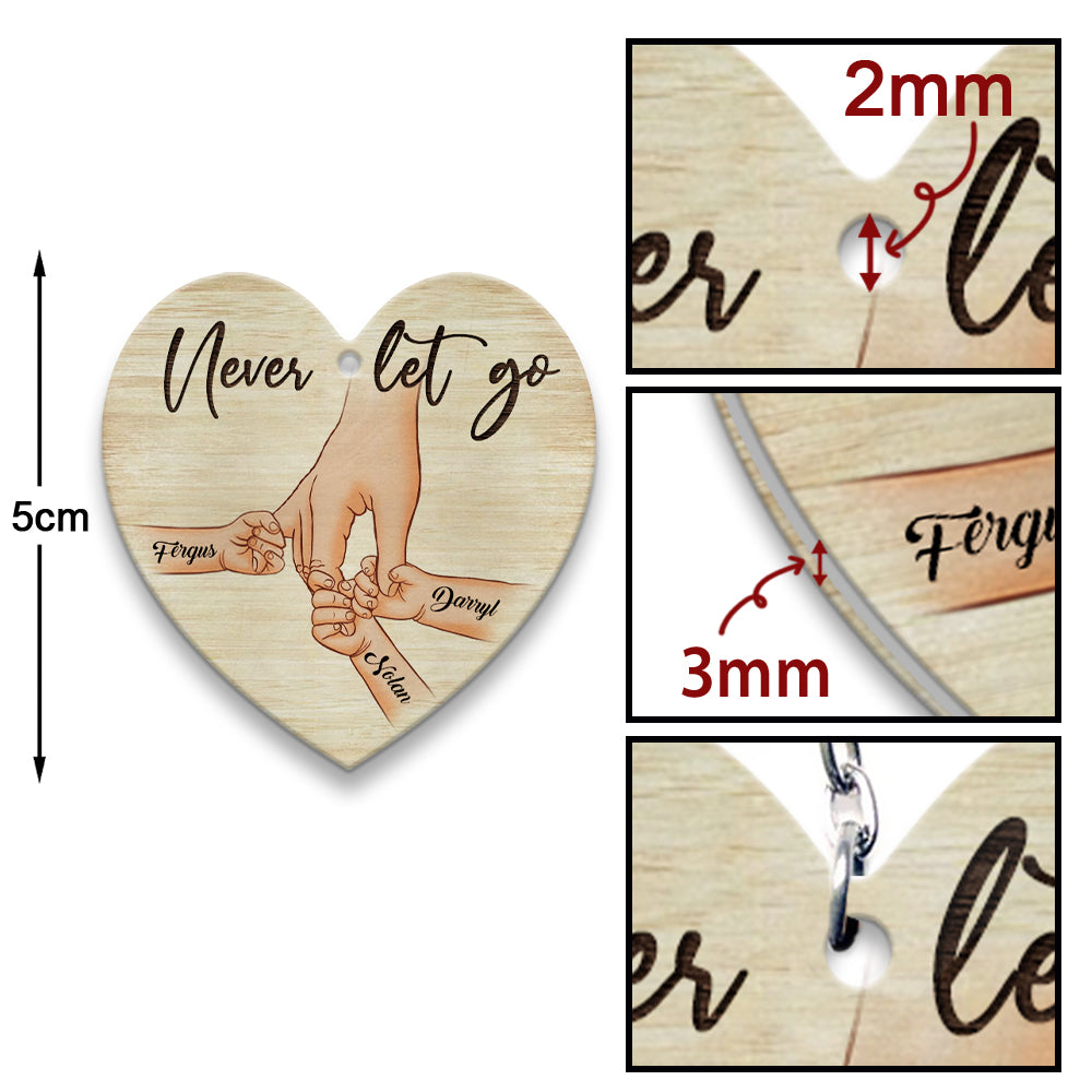 Personalized A Father Holds His Kid's Hand Never Let Go Heart Wooden Keychain